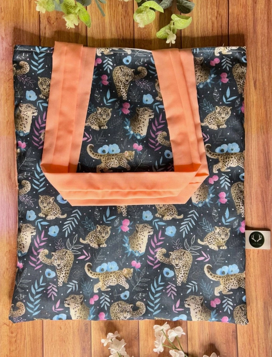 Snow Leopard themed printed tote bag with pink backing and handle